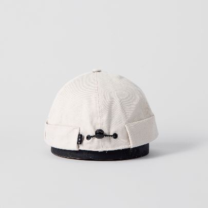 Picture of cream Docker hat 