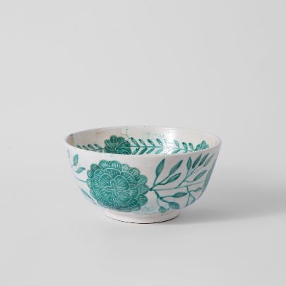 Picture of Turquoise clay bowl of slimy flower