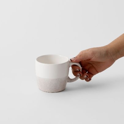 Picture of A white ceramic mug with a handle