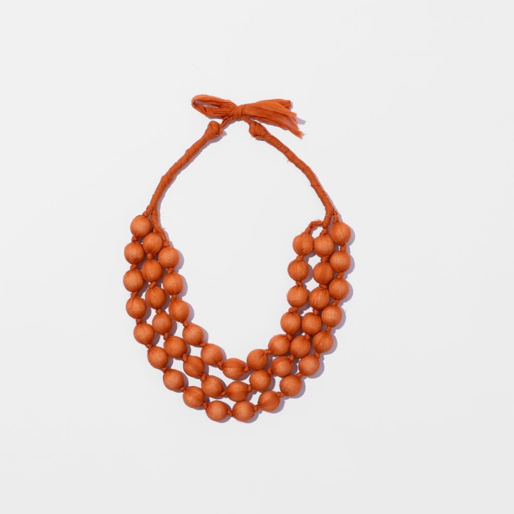 Picture of Orange fabric and bead necklace