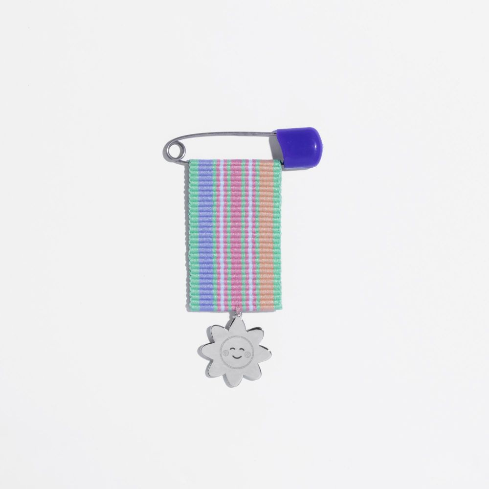 Picture of pink purple flower child medal