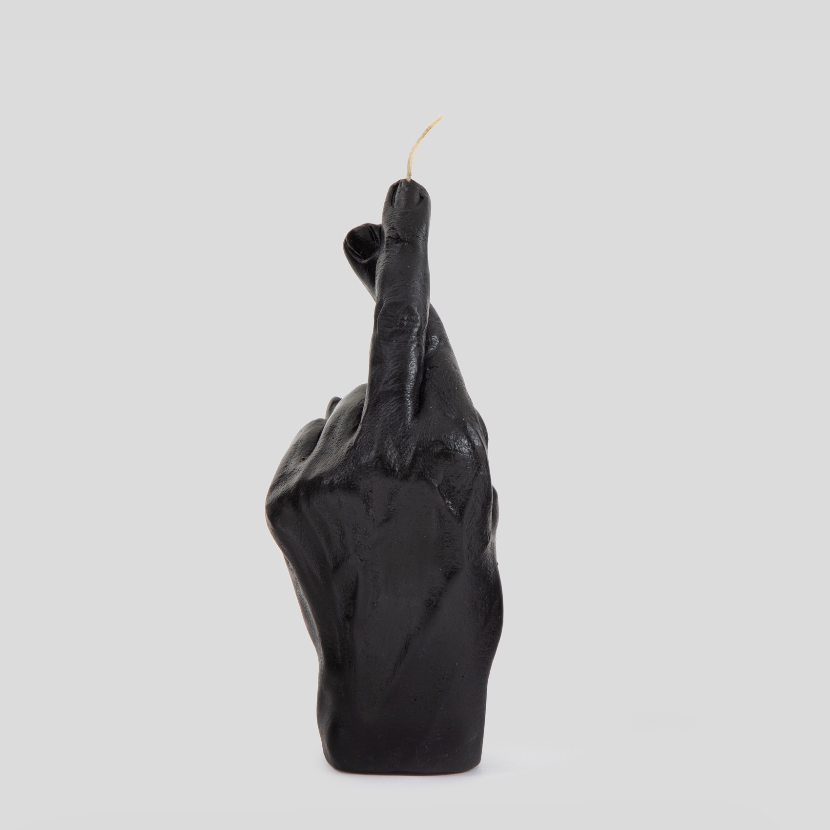 Picture of black finger crossed candle