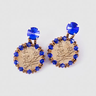 Picture of blue earrings with coin