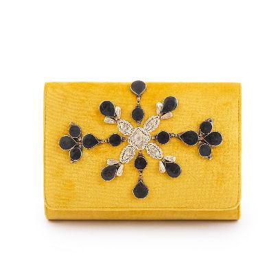 Picture of yellow velvet handbag with black stone