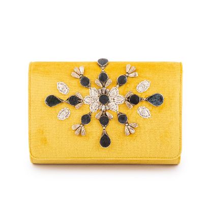 Picture of yellow velvet handbag with black stone