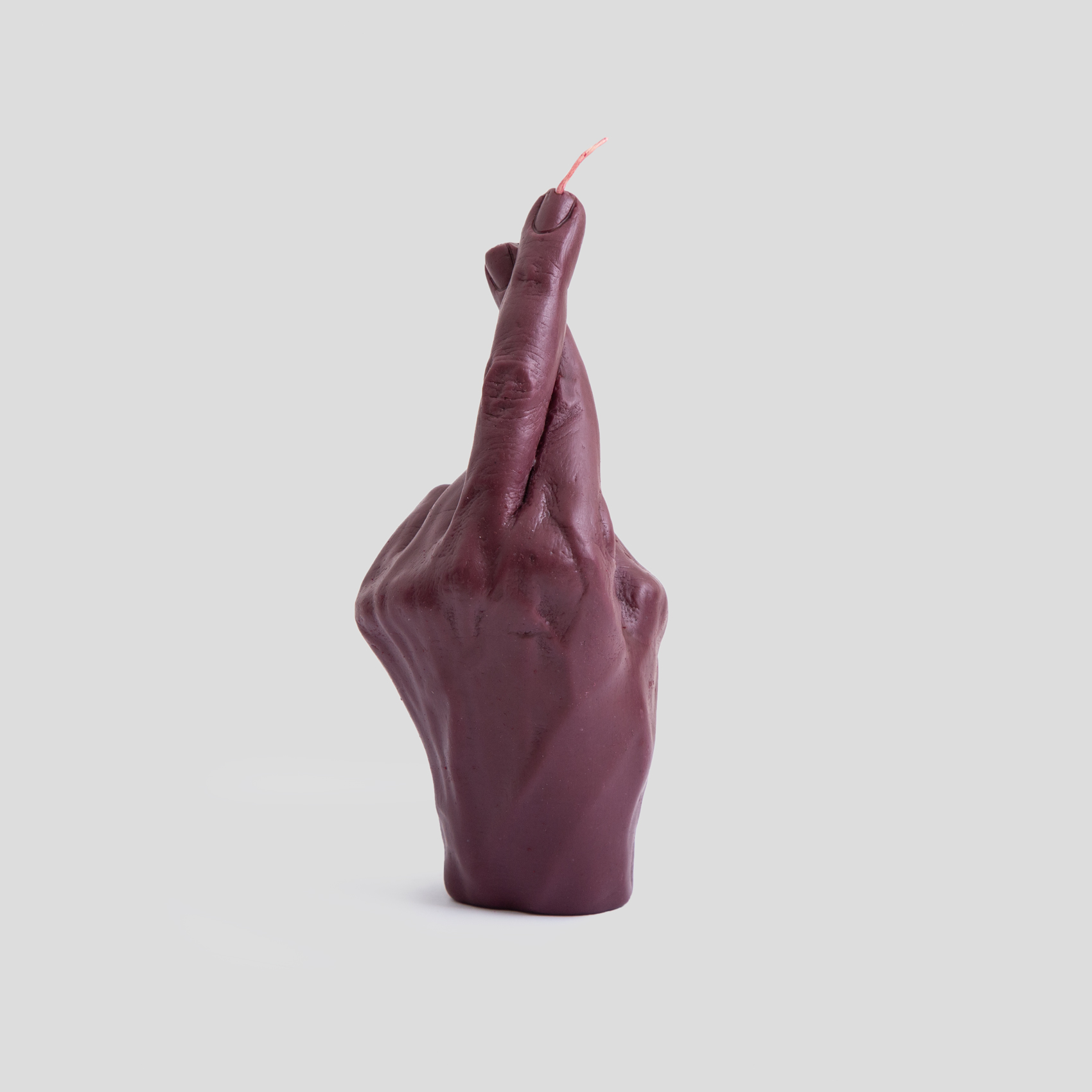 Picture of dark red finger crossed candle