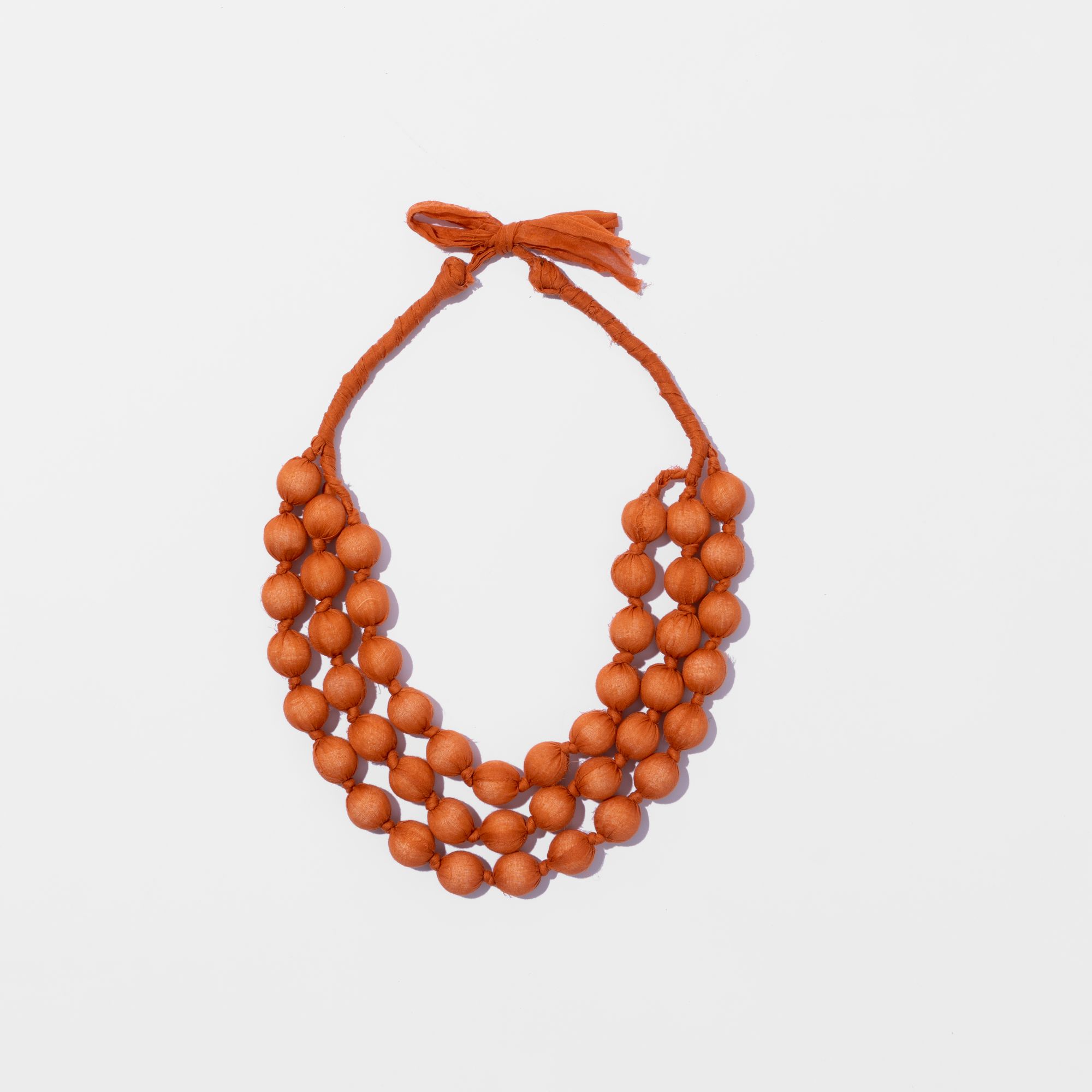 Picture of Orange fabric and bead necklace